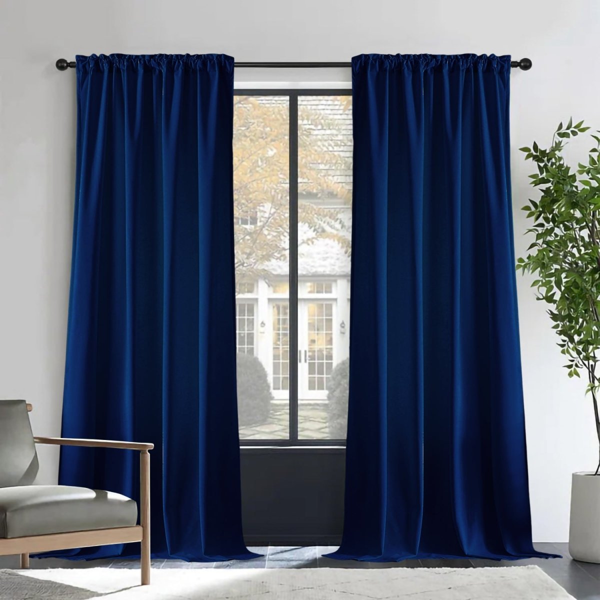Deep royal blue velvet blackout curtains with rod pocket, luxurious texture, room integration.