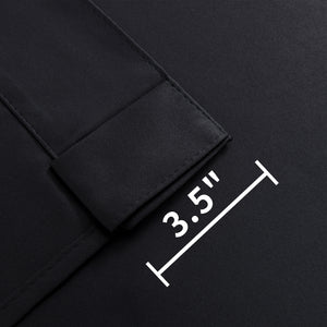 Close-up of Joydeco black blackout curtain fabric showing 3.5-inch back tab for hanging options.