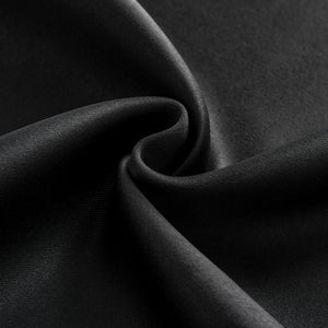 Close-up black blackout curtain fabric texture, dense polyester weave, matte finish, soft folds for room darkening.
