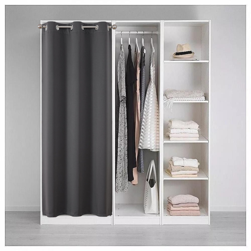 Dark gray polyester closet door curtain with silver grommets, providing privacy for an open closet with clothes and shelves.