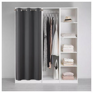 Dark gray polyester closet door curtain with silver grommets, providing privacy for an open closet with clothes and shelves.