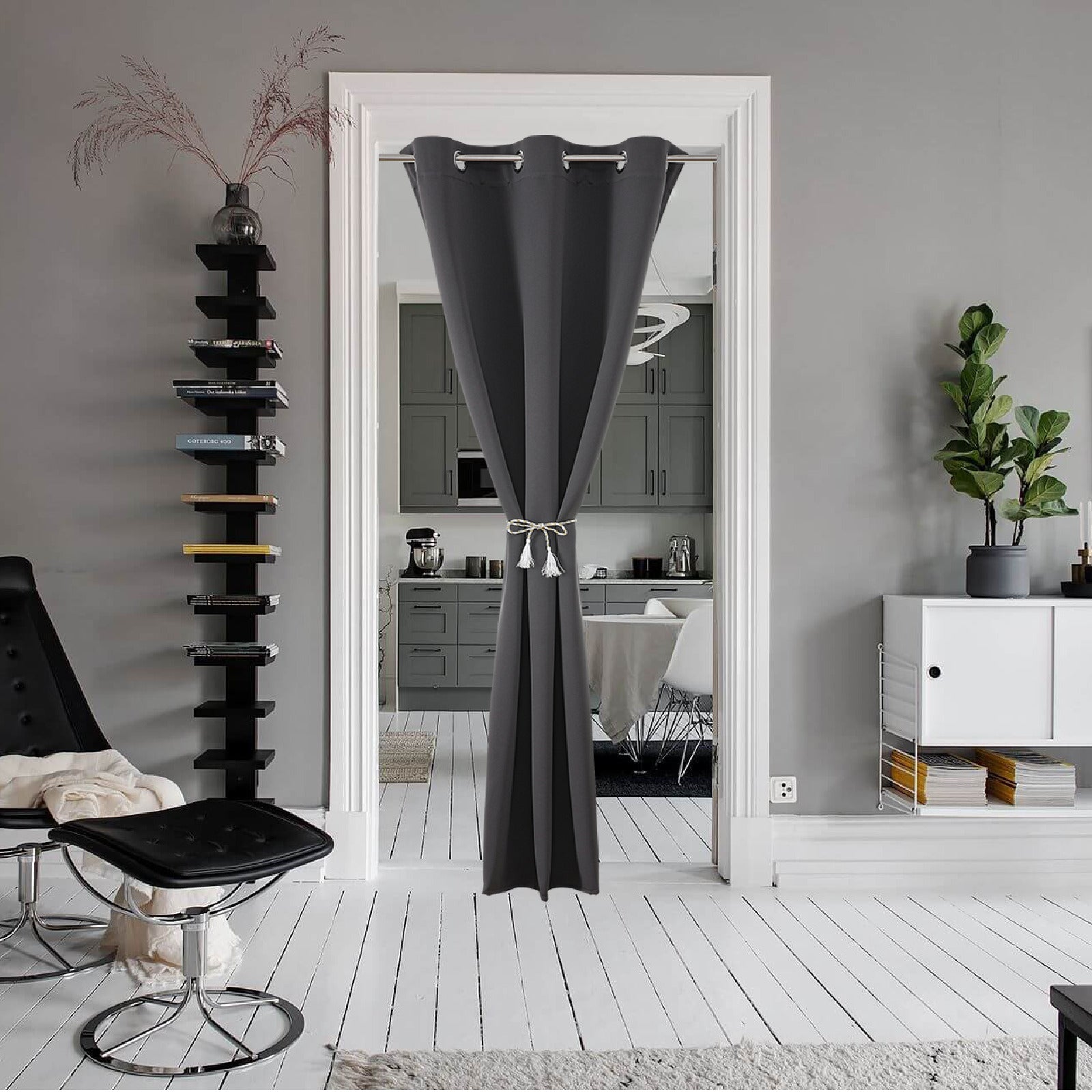 Dark gray polyester doorway curtain with silver grommets, tied back to reveal kitchen. Used for privacy and room decor.