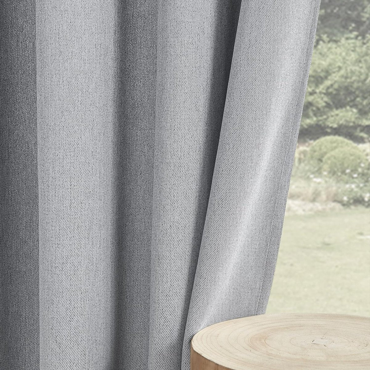 Light gray Joydeco faux linen blackout curtain texture and drape detail, blocking outdoor view.