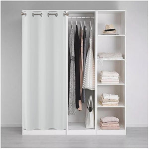 White blackout curtain as room divider for closet with clothes and shelves.