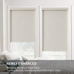 Beige cordless blackout roller shades with woven texture and matching aluminum valances installed in white windows.