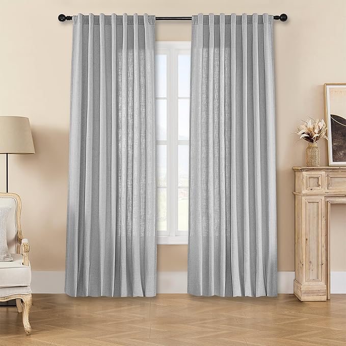 Ebony Grey Joydeco linen curtains with back tabs filter light in living room.