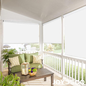 Joydeco white cordless blackout roller shades on outdoor porch windows with green sofa and coffee table.