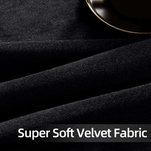 Close-up of black velvet fabric texture with plush feel, showcasing luxurious soft velvet curtain material.