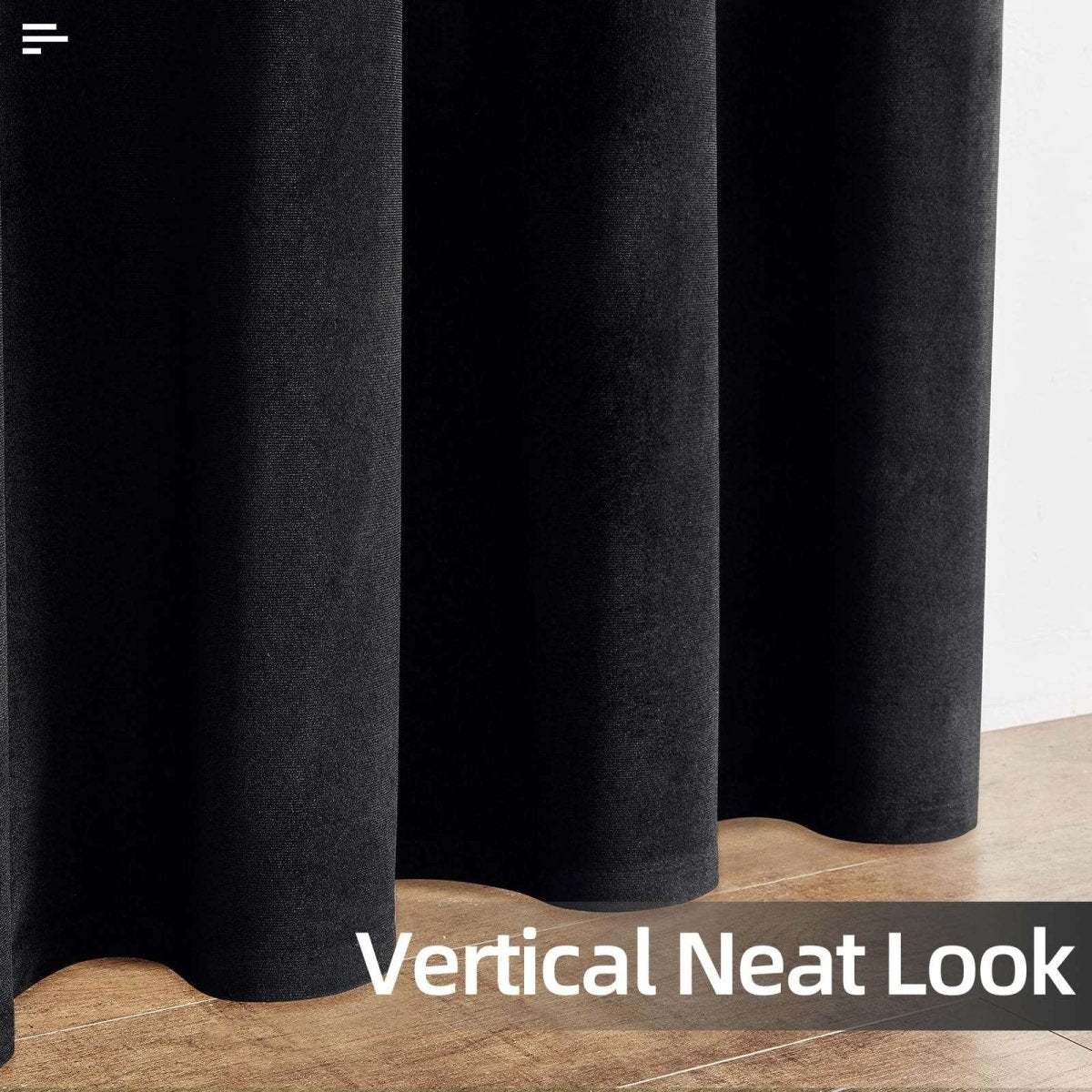 Close-up of black velvet blackout curtains showcasing plush texture and vertical folds, highlighting a neat look.