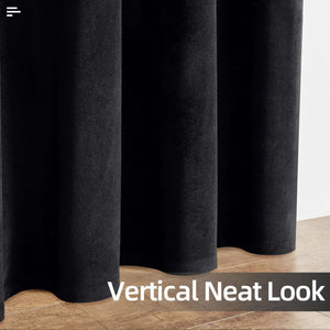 Close-up of black velvet blackout curtains showcasing plush texture and vertical folds, highlighting a neat look.