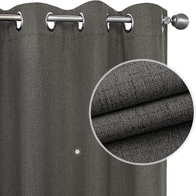 Close-up of charcoal gray 100% blackout linen curtain, thermal insulated, with grommets and textured weave.