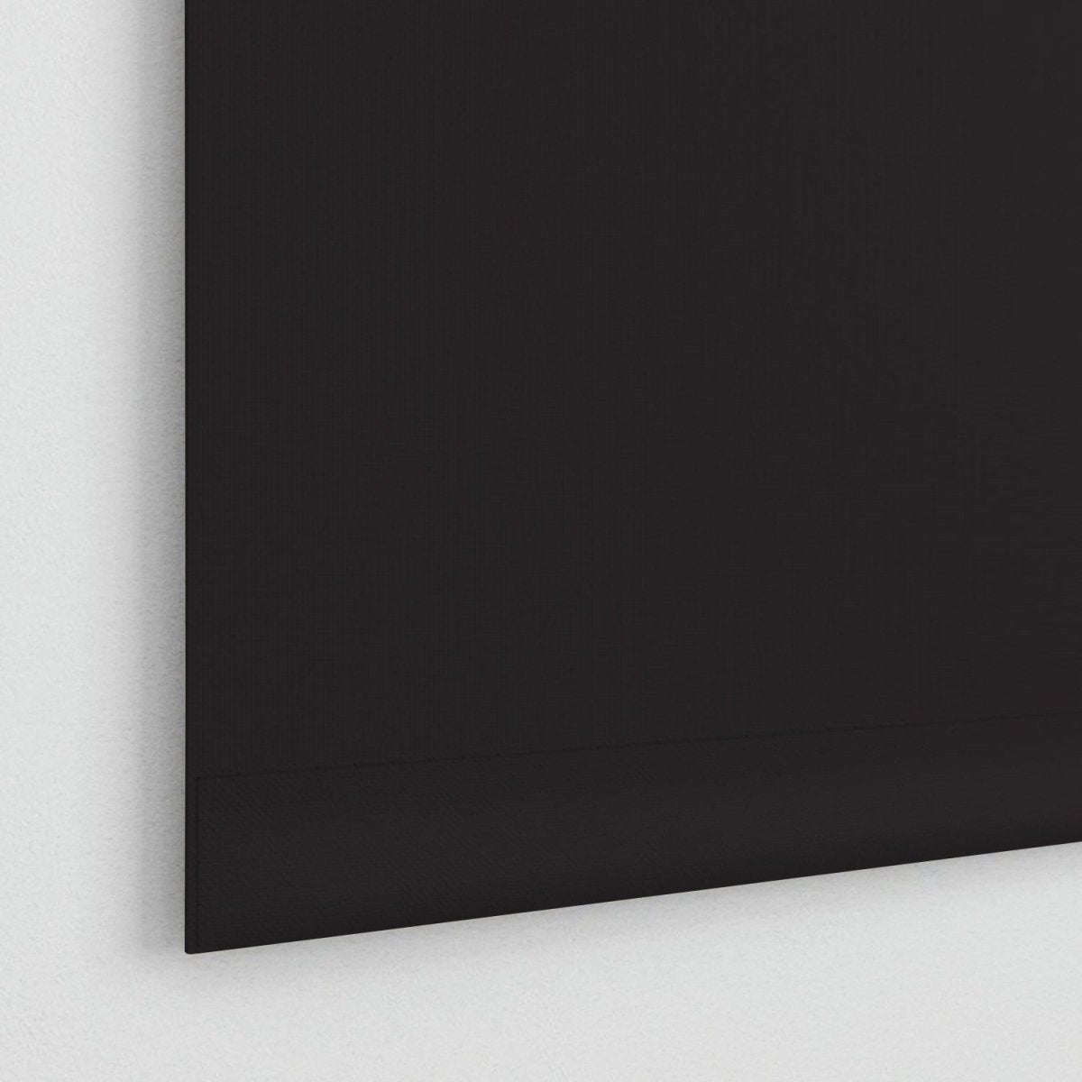 Joydeco black cordless blackout roller shade with striped jacquard fabric texture against white wall.