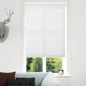 Joydeco white light filtering cordless cellular shade on a window in a modern living room.