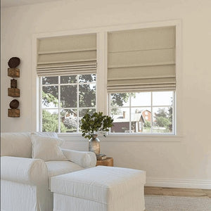 Beige woven motorization Roman shades, blackout, horizontal pleats on windows in living room setting.