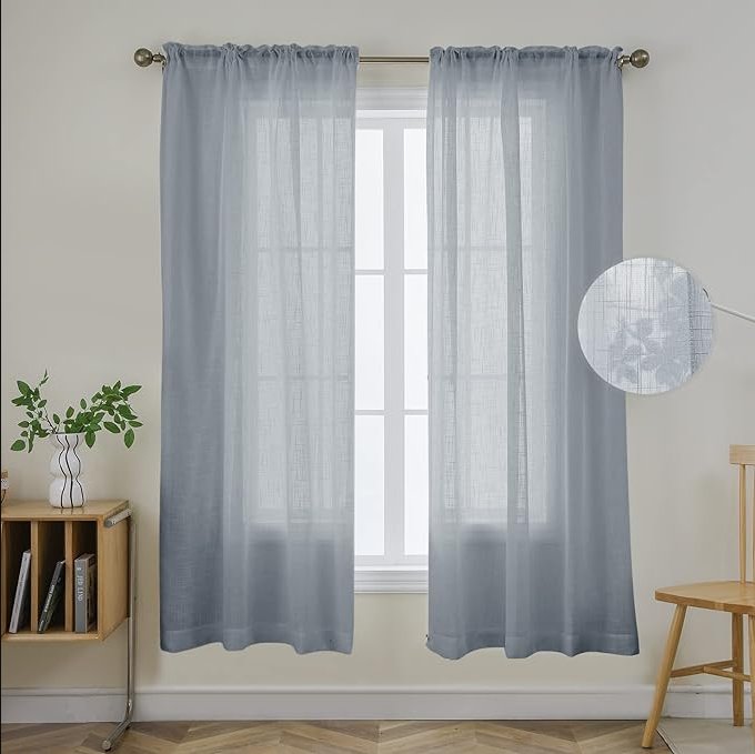 Joydeco custom sheer blue curtains with linen texture and rod pocket, featuring subtle floral pattern, in a room.