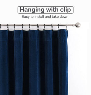 Deep navy velvet curtain hanging on silver rod with clips, showing easy installation method.
