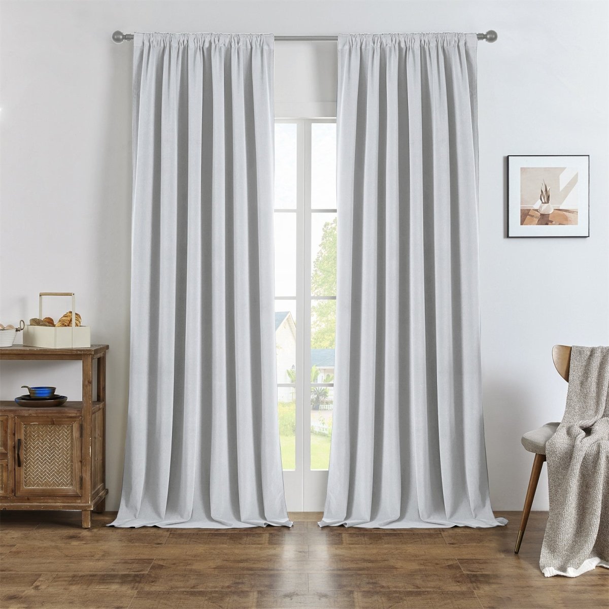 Light grey custom linen blackout curtains with natural texture hung on a silver rod, enhancing room appearance and texture.