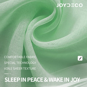 Joydeco mint green sheer curtain, close-up of voile texture with elegant diamond embroidery. Soft, light filtering.