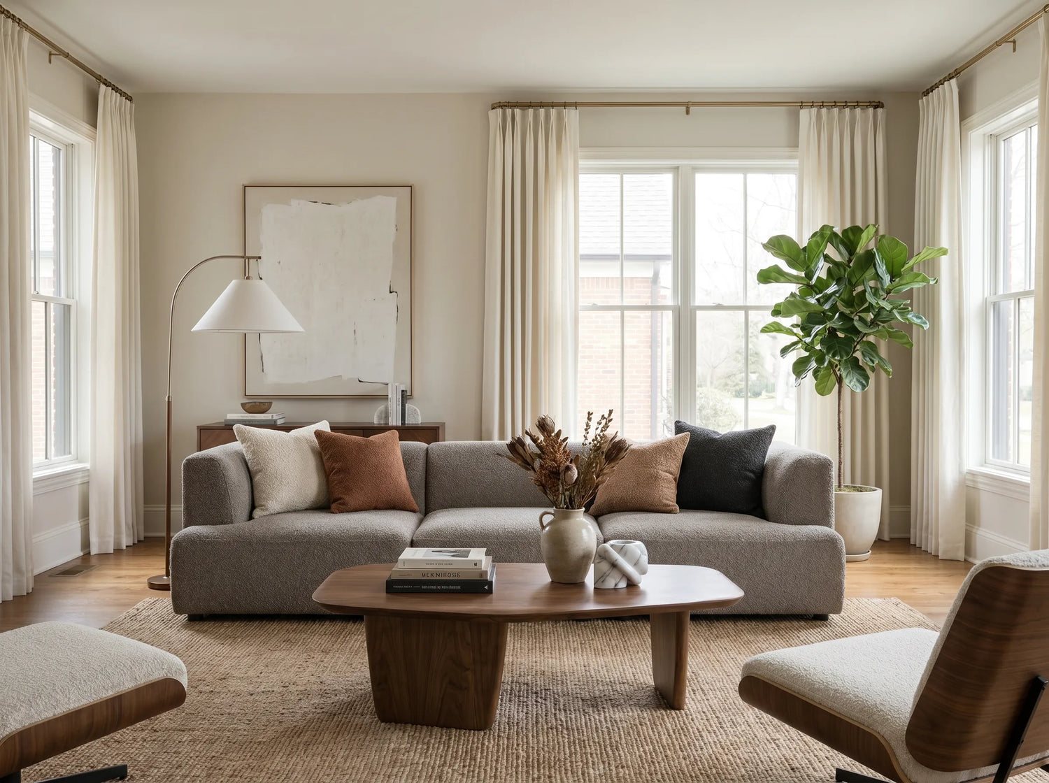 Joydeco pleated cream curtains installed on multiple living room windows.