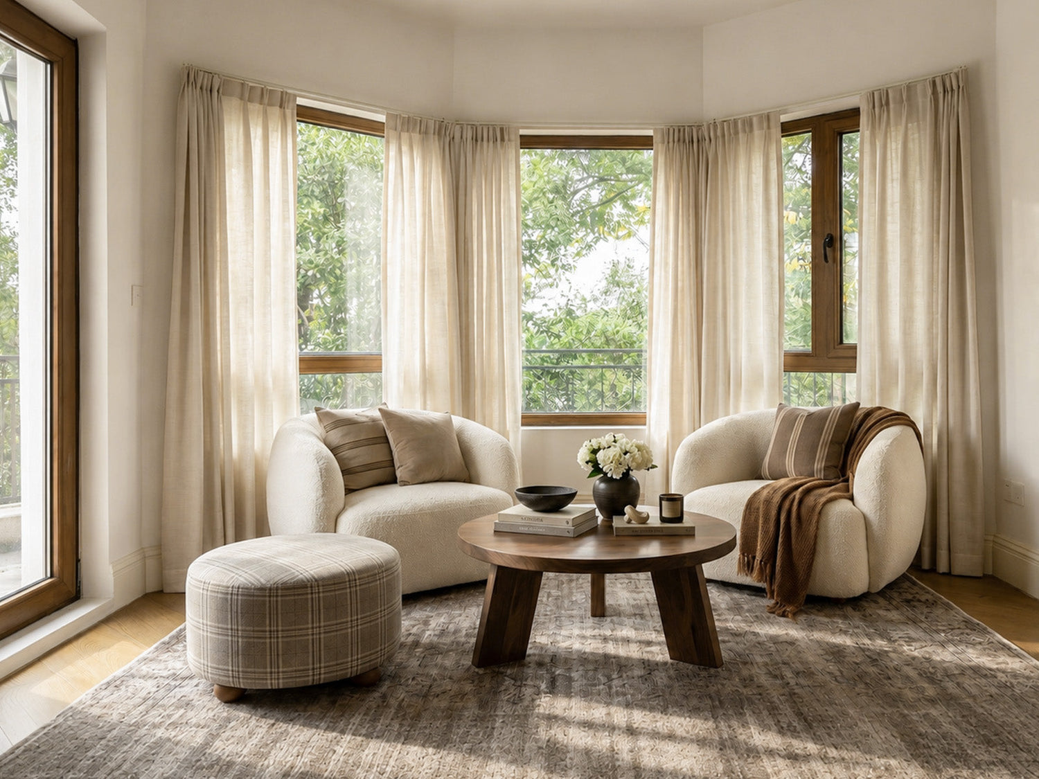 Joydeco cream sheer curtains on a bay window in a warm living room.