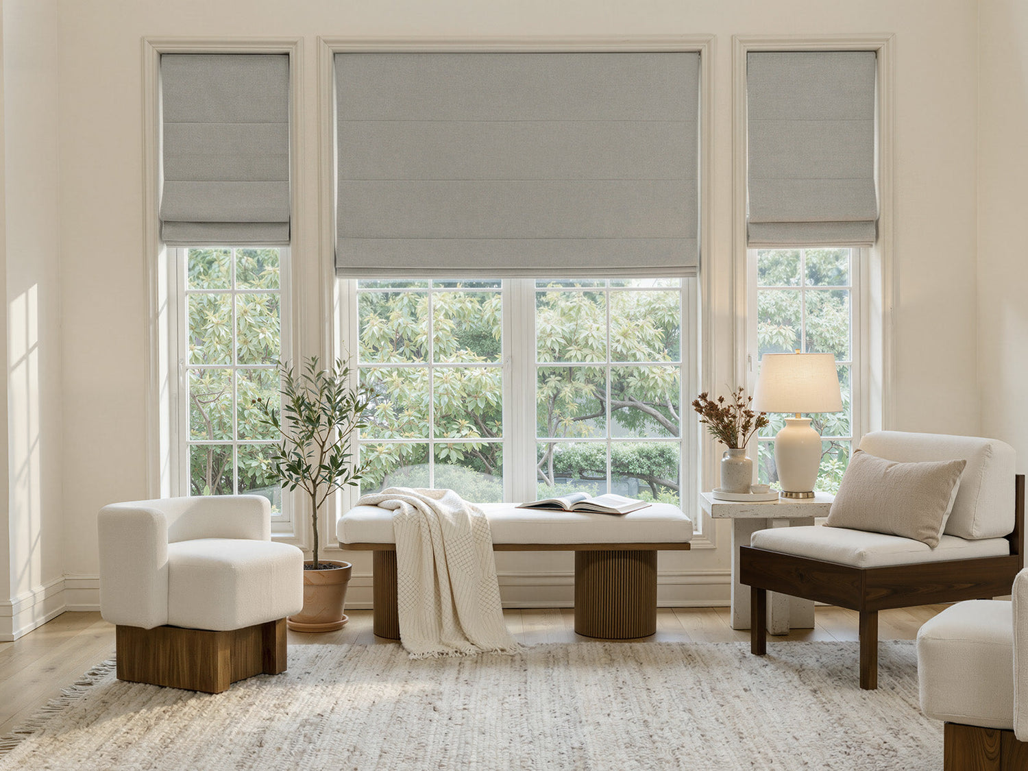 Modern bedroom with white zebra blinds on two windows flanking the bed.