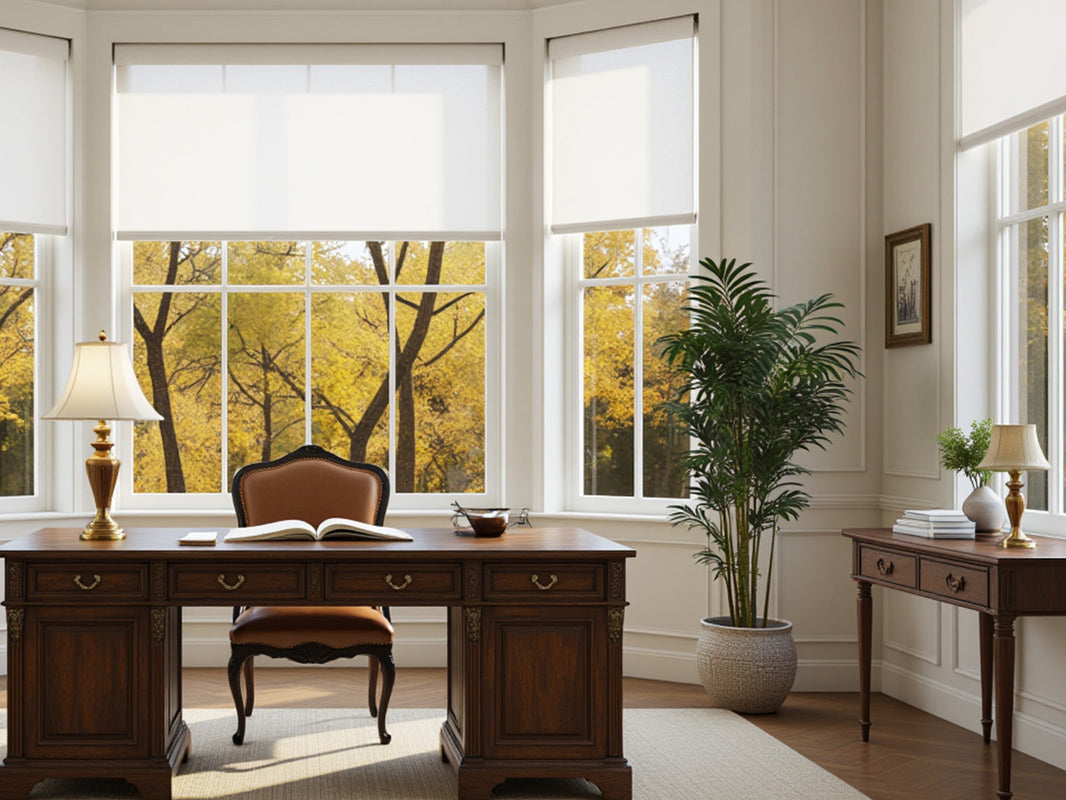 A classic and elegant home office setup featuring large windows with white roller blinds.