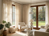 Vintage curtains styled in a modern minimalist living room with neutral tones, natural light, and contemporary furniture.