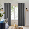 Dark grey polyester blackout curtains with grommet tops shown on rod in a living room setting.