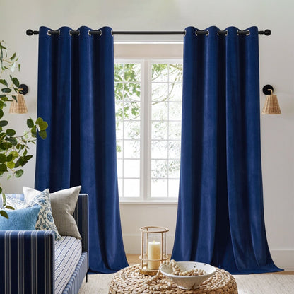Two royal blue velvet blackout curtains with grommets on rod, framing window with daybed. Thermal insulated, privacy.
