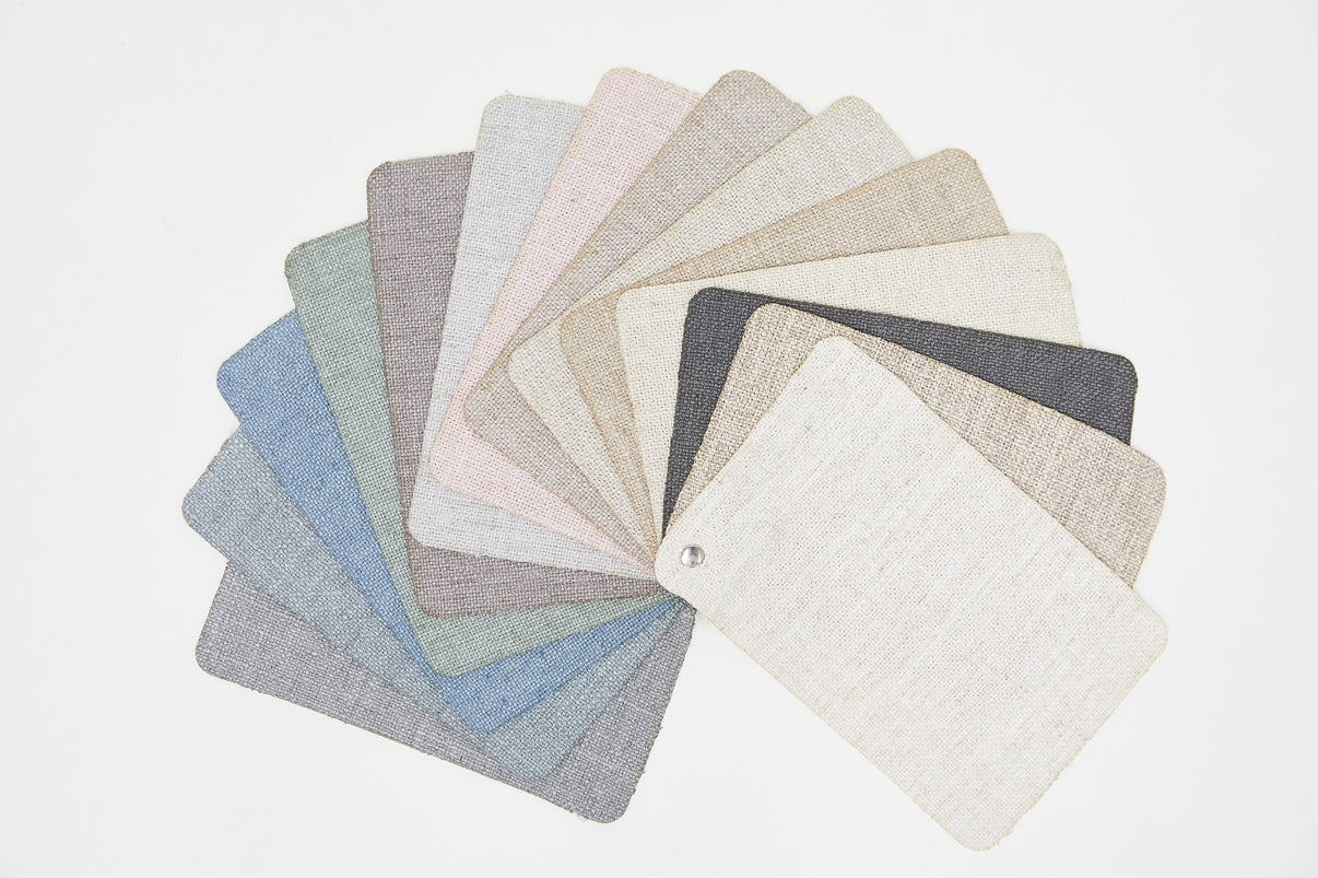 Flaxaline Linen Blackout Curtains sample booklet showcasing 14 color options in a fan arrangement.