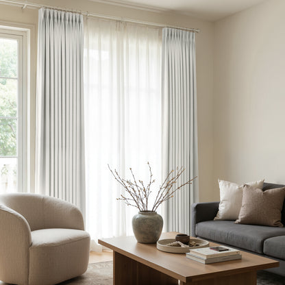Arden light grey satin blackout curtains with elegant pleats, modern window treatments.