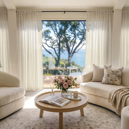 Feather custom lightweight off-white sheer curtains in airy, light-filled room.