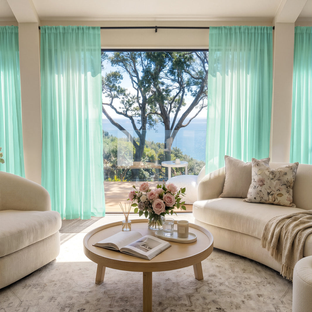 Joydeco lightweight aqua sheer curtains filtering sunlight for an airy, elegant living room.