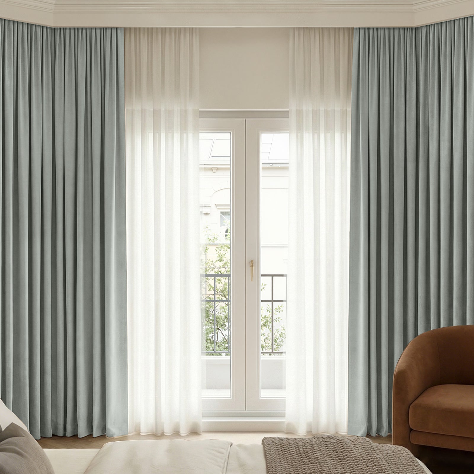 Bennett Chenille grey-blue blackout curtain layered with sheer white drapes.