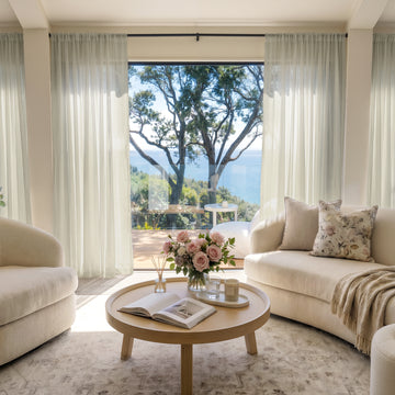 Feather Custom Lightweight Sheer Curtain in a bright, elegant living room setting.
