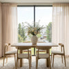 Light beige custom sheer curtains with linen texture, soft light filtering.
