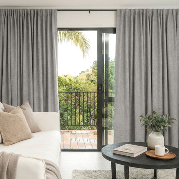 Alder custom blackout curtains in grey faux linen texture.