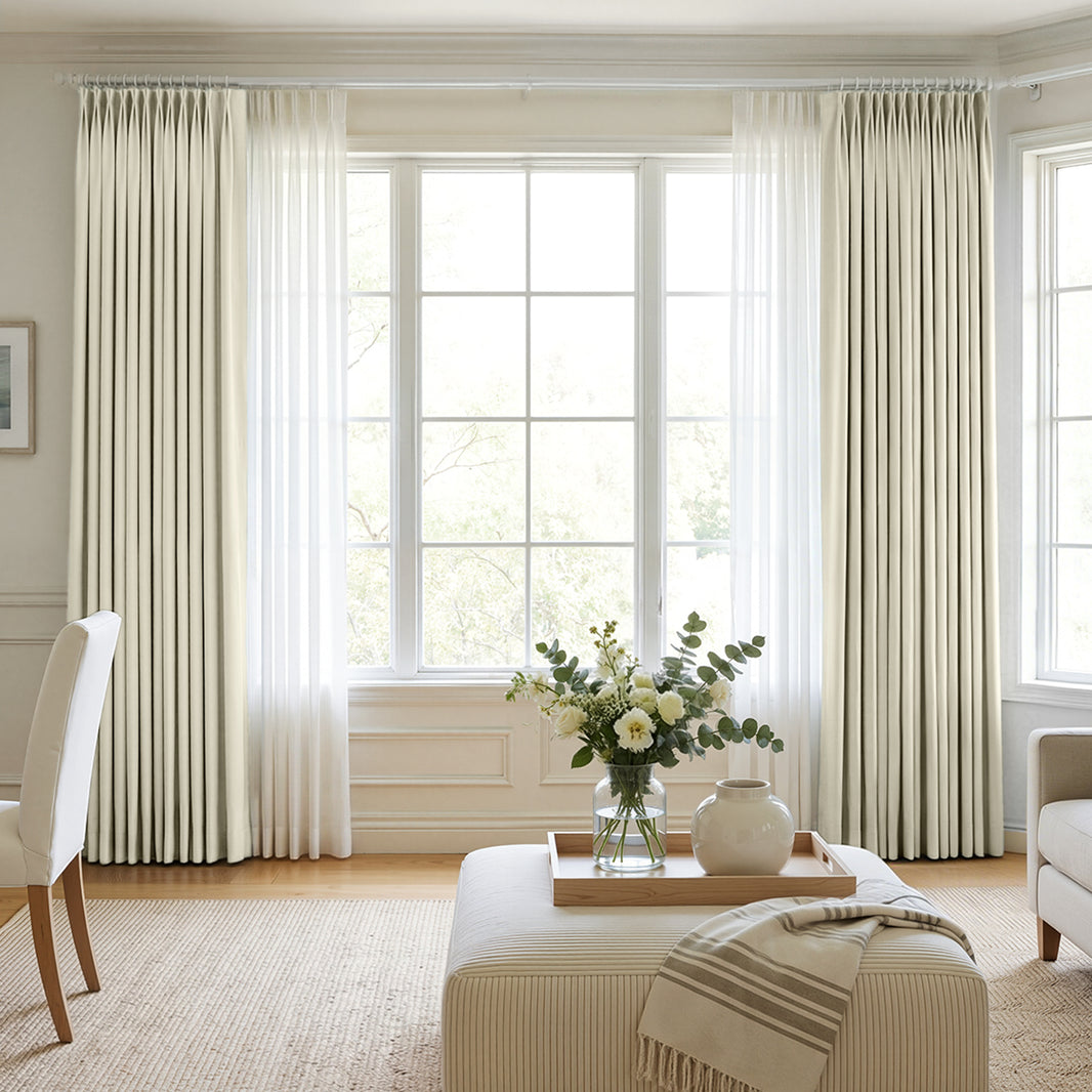 Cream chenille blackout curtains by Joydeco, styled with sheer panels for custom window treatments.