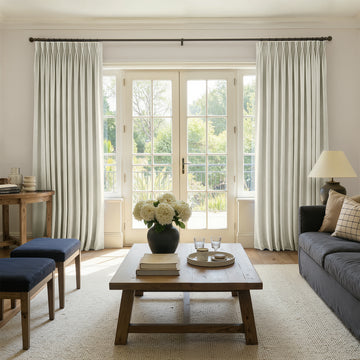 Sloane light neutral velvet room darkening curtains with elegant pleats.