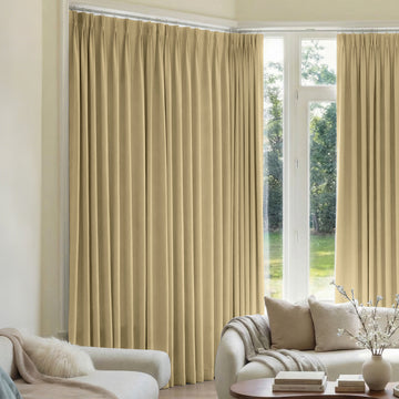 Mason triple weave blackout curtains in beige with detailed pleats for custom window treatments.