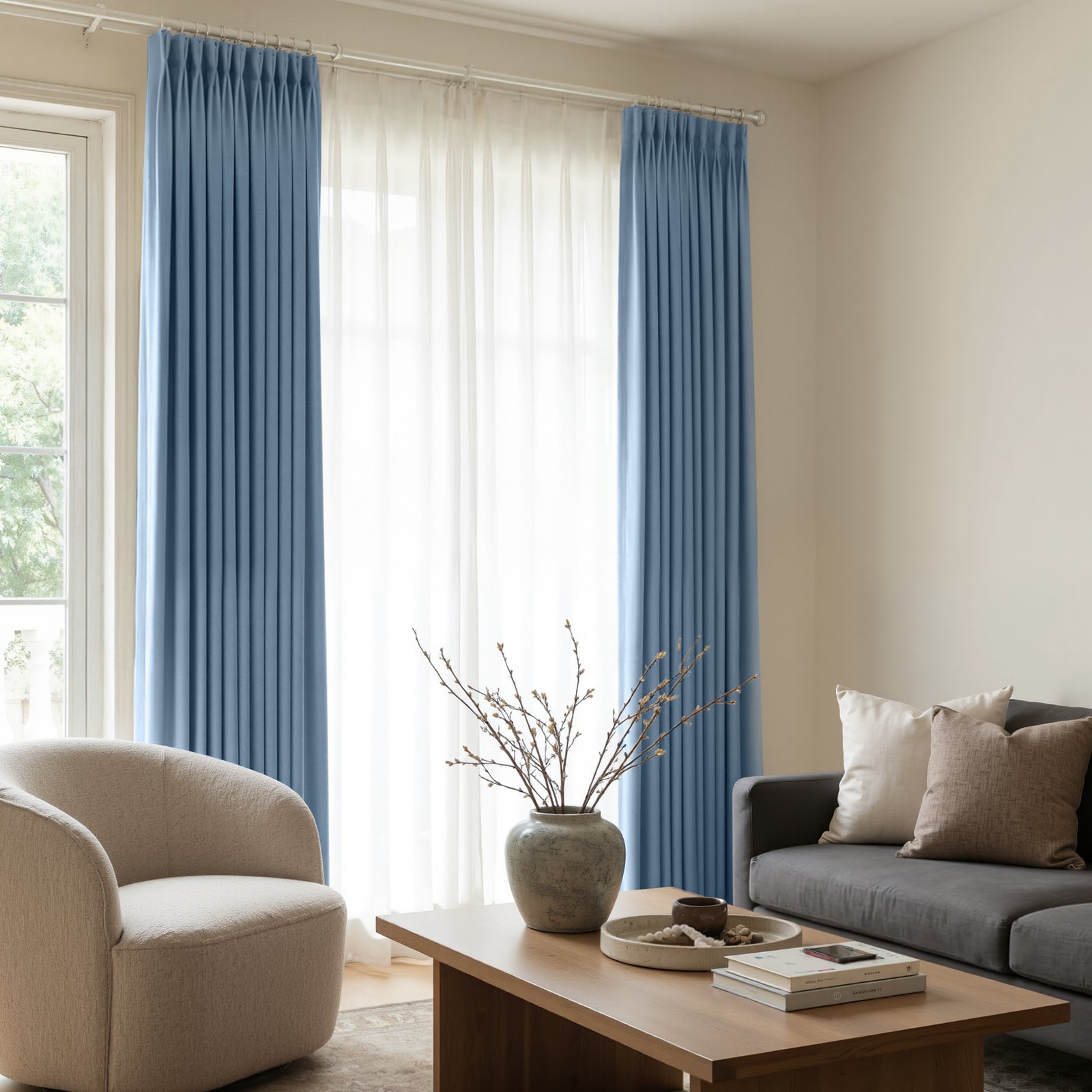 Blue satin blackout custom curtains with lustrous finish and elegant pleats