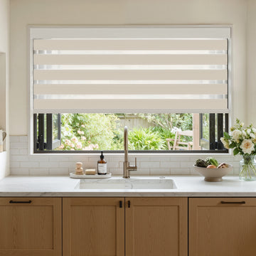 Marlow Light Filtering Zebra Shade with alternating beige and white bands.