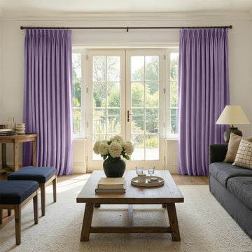 Purple velvet room darkening curtains with elegant pinch pleats, enhancing home decor.