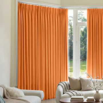 Orange custom triple weave blackout curtains, pleated header, window treatment.