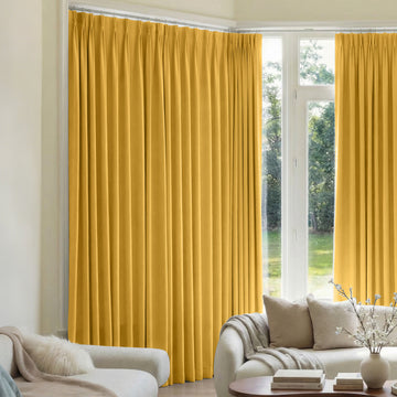 Custom Mason Triple Weave blackout curtains in bright yellow.
