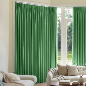 Vibrant green custom blackout curtains with triple weave texture and pleated heading.