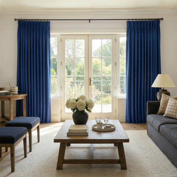 Sloane custom velvet room darkening curtains in deep blue, featuring elegant drape and plush texture.