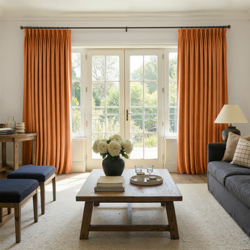 Sloane orange velvet custom curtains with elegant pleats and rich texture.