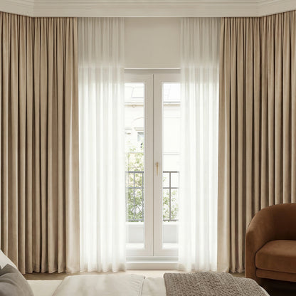 Beige Bennett Chenille blackout curtain layered with sheer custom window treatments.