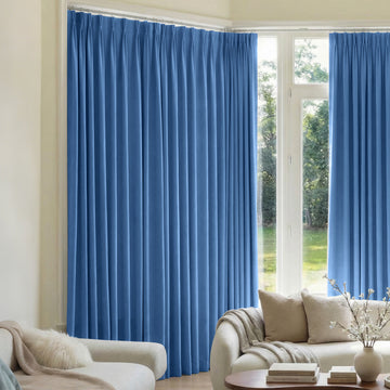 Mason Triple Weave Blackout Curtain in blue, custom-made with pleats for light control.